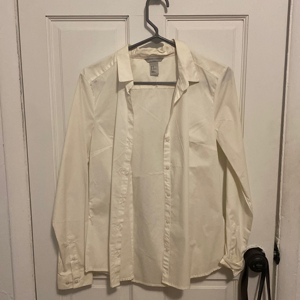 Brand new, white/cream colored button-down, never worn.